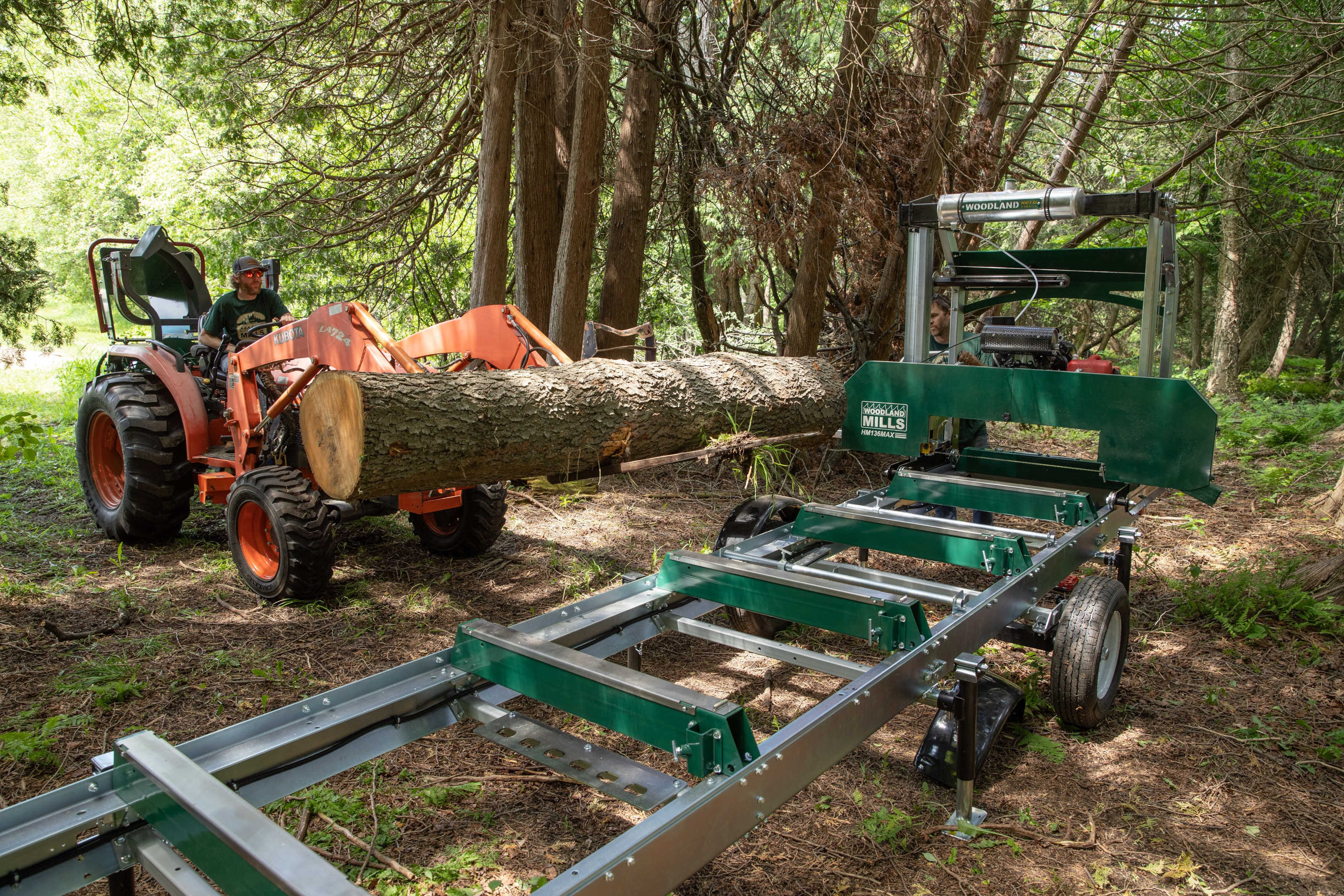 A sawmill operator about to load logs onto his portable sawmill. 