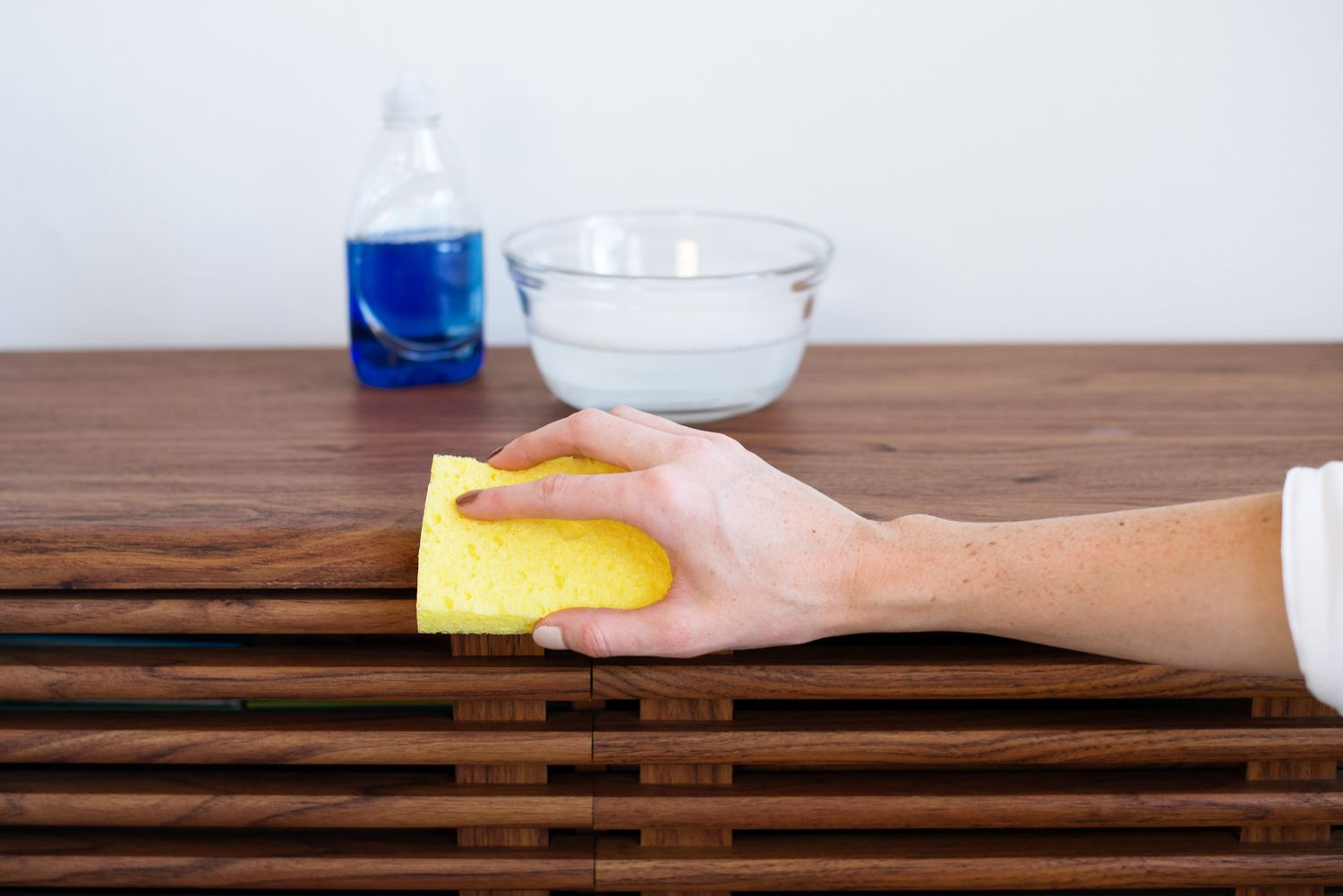 Use a dish soap gentle cleaning solution when cleaning wooden furniture to remove grime