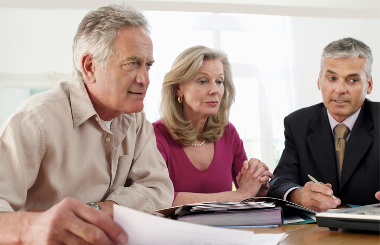 A picture showing a financial advisor with clients