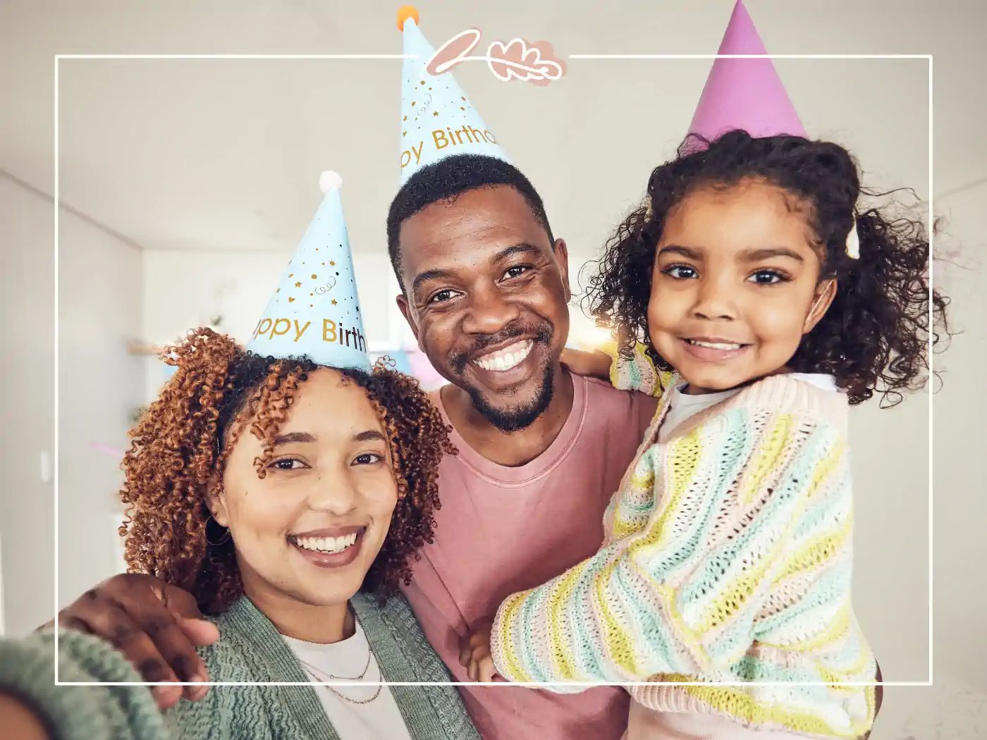 Family of three wearing birthday hats and smiling for a selfie. Happy birthday wishes for a wonderful day. Fabulous Flowers and Gifts.