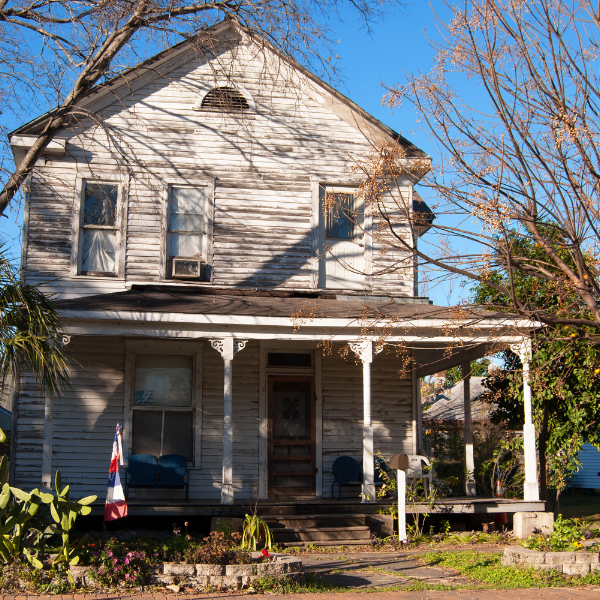 An image showing deteriorating siding on a house.