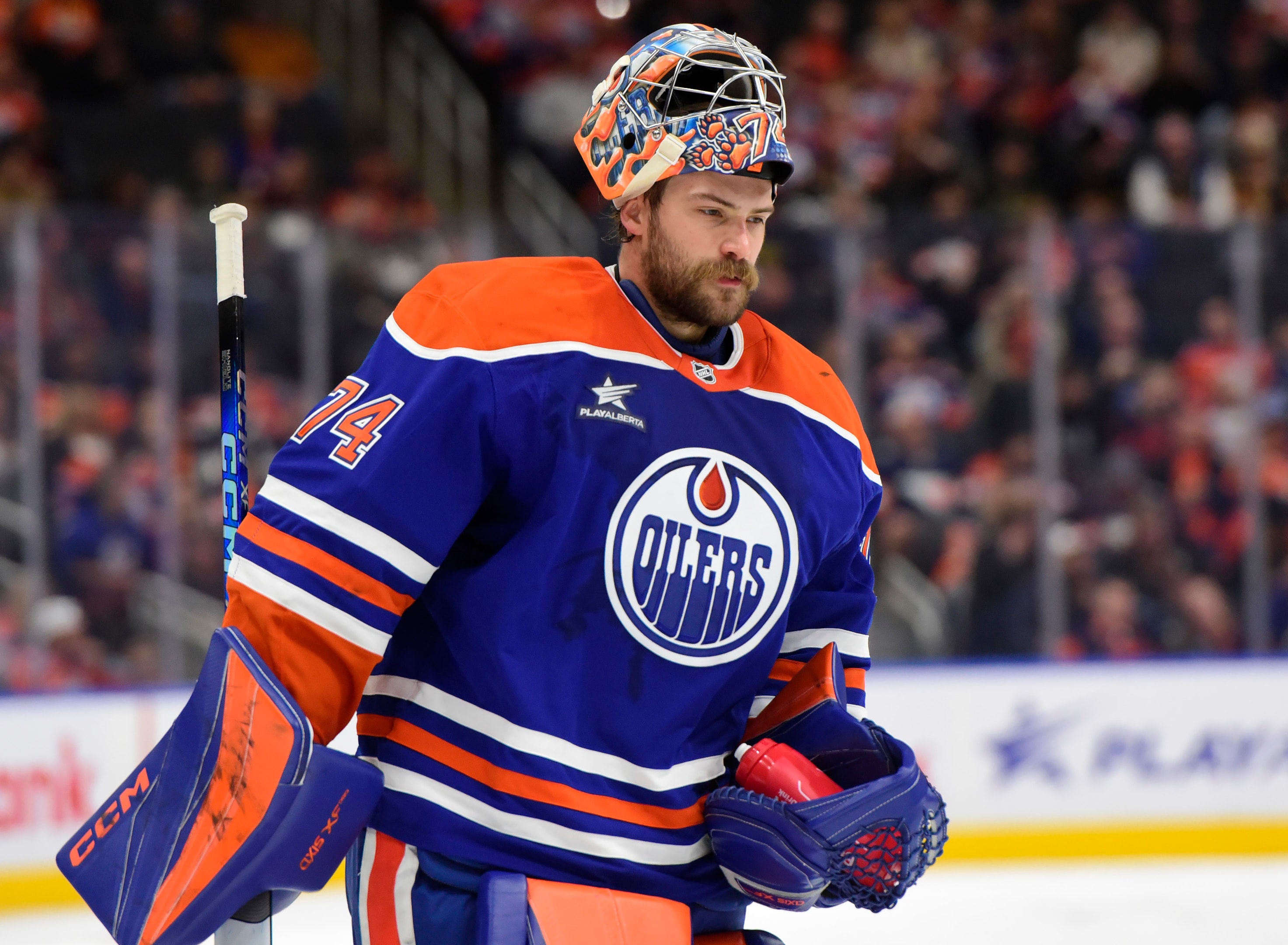 Stuart Skinner of the Edmonton Oilers returns to his crease during a preseason game against the Vancouver Canucks at Rogers Place on September 30, 2024, in Edmonton, Alberta, Canada.