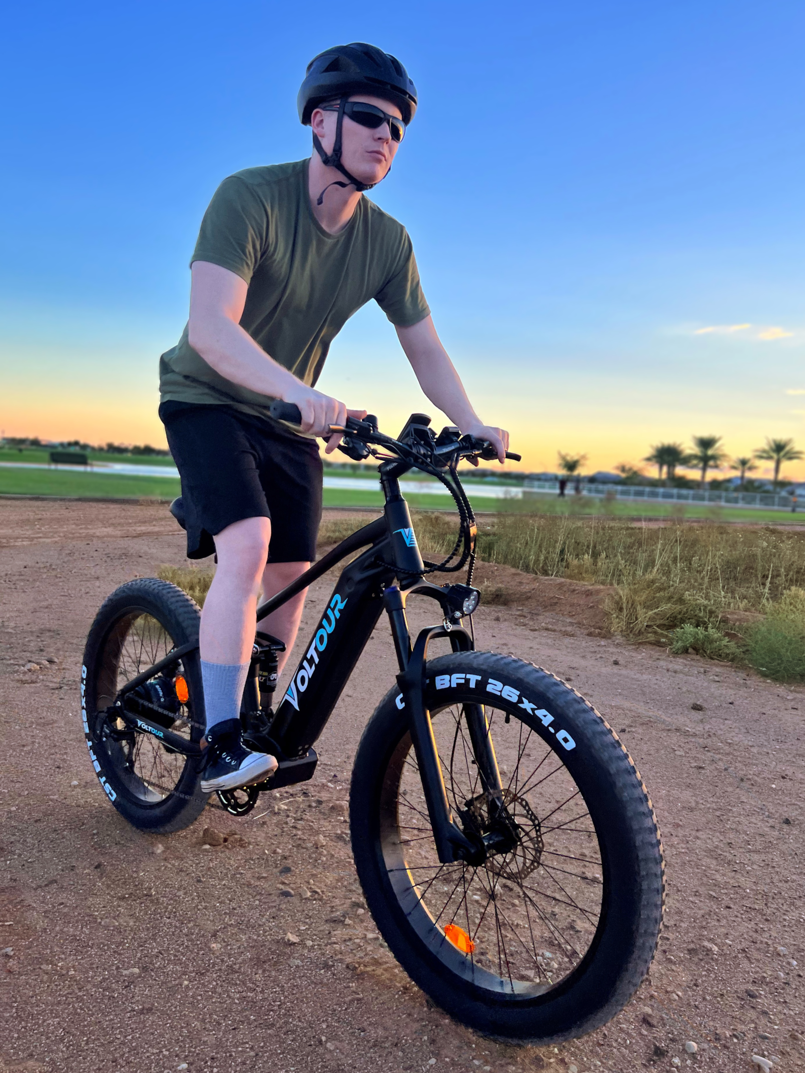 person on mountain ebike on gravel road