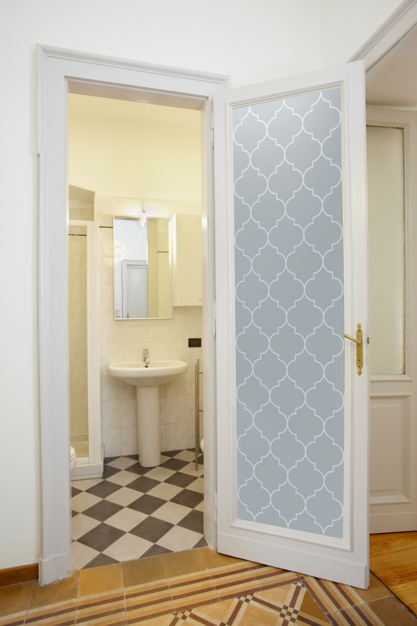 A bathroom door with glass made of frosted glass, providing privacy and elegance to any space.