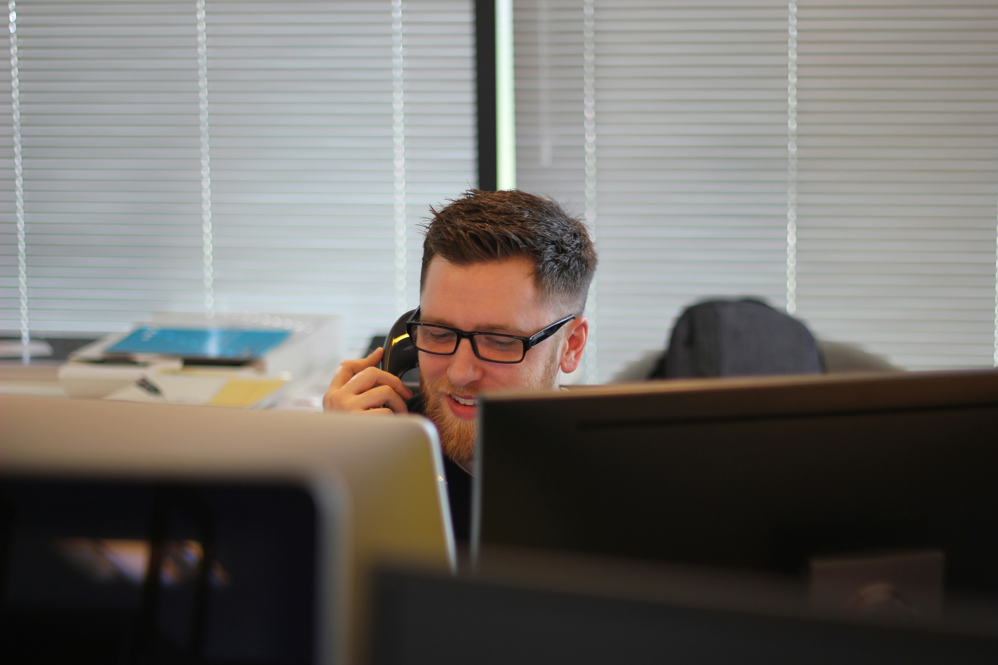 Real estate investor takes phone call from lead generated through direct mail.