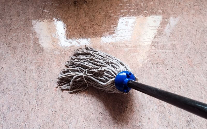 Use the damp mop to start cleaning the flooring materials