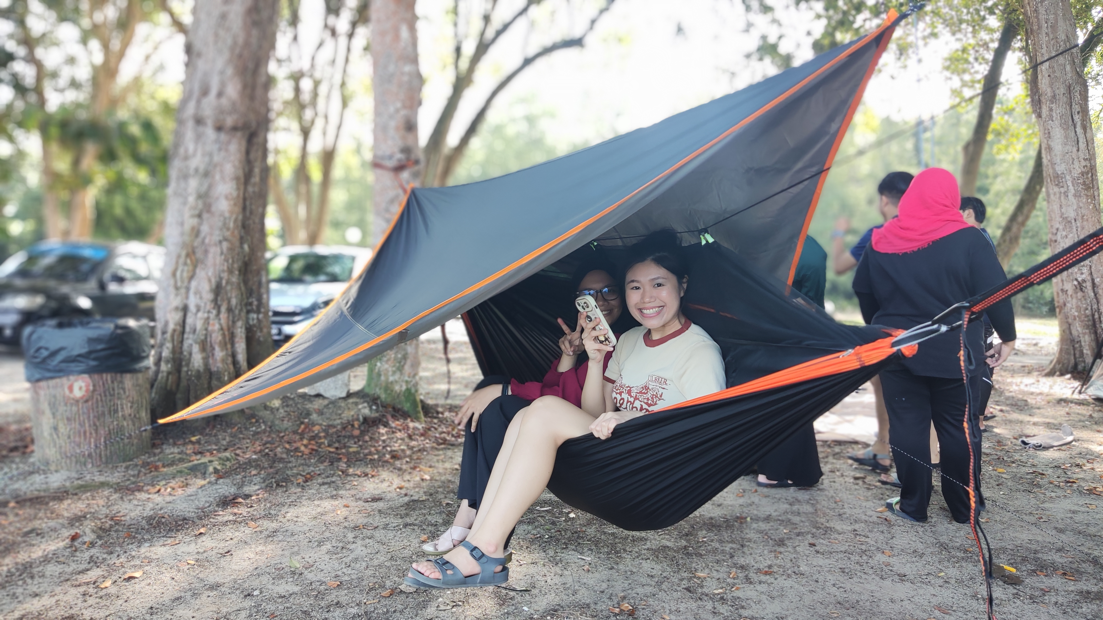 A group of people enjoying glamping in Malaysia's urban and jungle locations