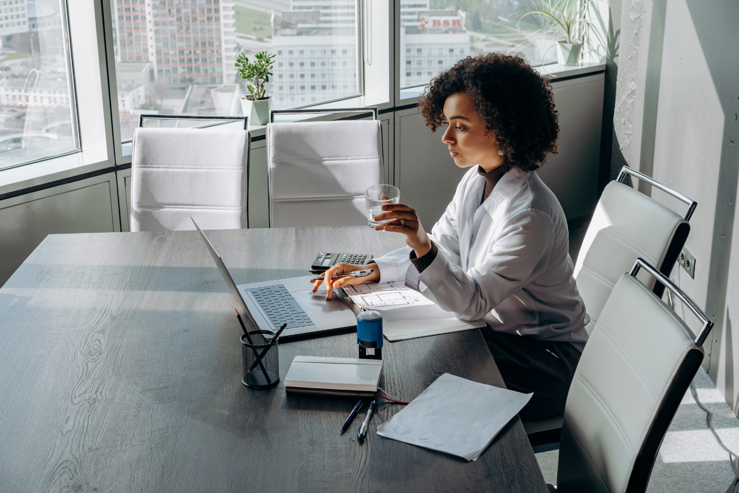 Businesswoman on her desk while working on her laptop.