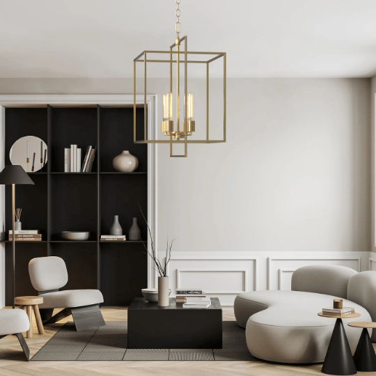 Contemporary living room with neutral-toned furniture, a black shelving unit, and a gold geometric chandelier hanging above a black coffee table.