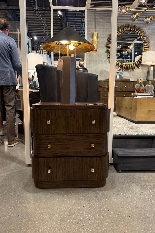 an end table made from natural materials by an interior designer in two wood types at High Point