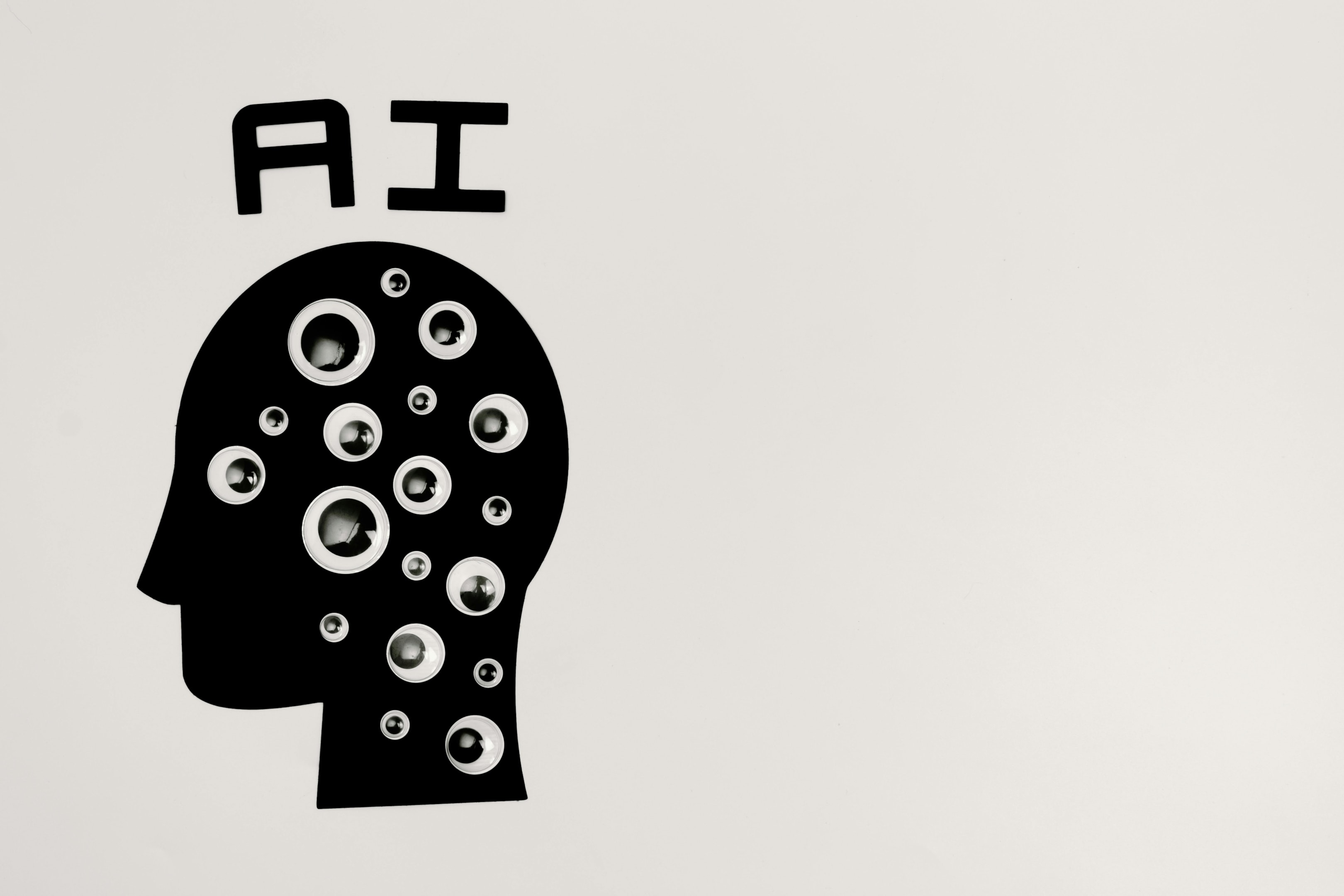 Silhouette of man with AI written above.