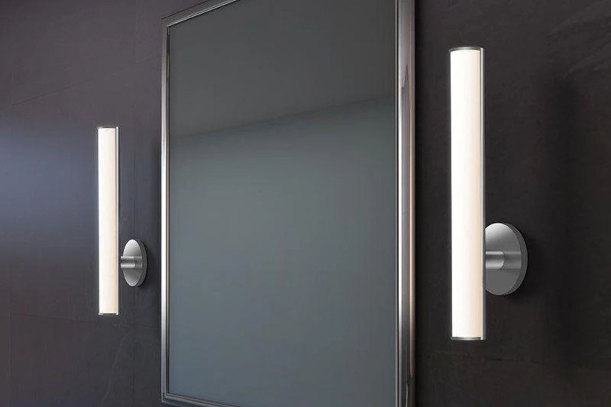 Bauhaus Columns 32" LED Bath Bar placed on each side of mirror, a sleek lighting product that adds a refined sign to the space.
