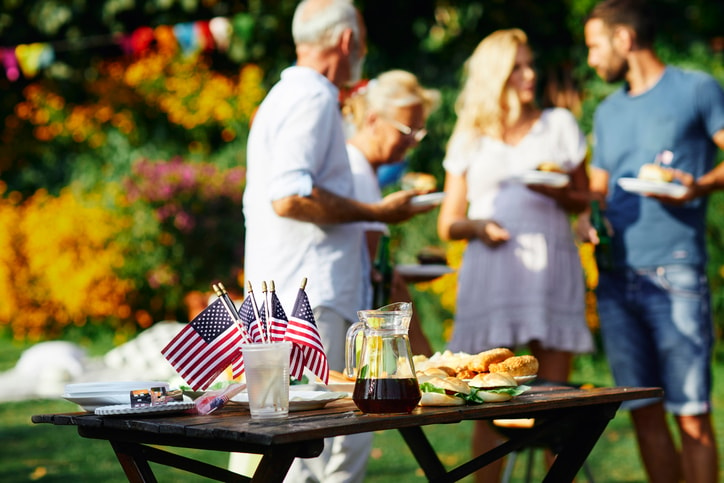 Family celebrating Labor Day with a cookout. 