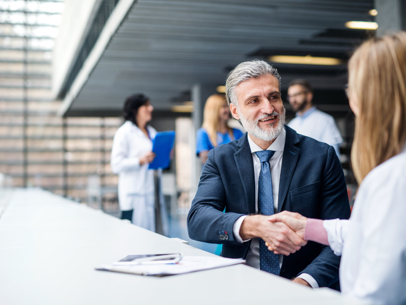 Image of a personal injury attorney and a medical professional meeting.