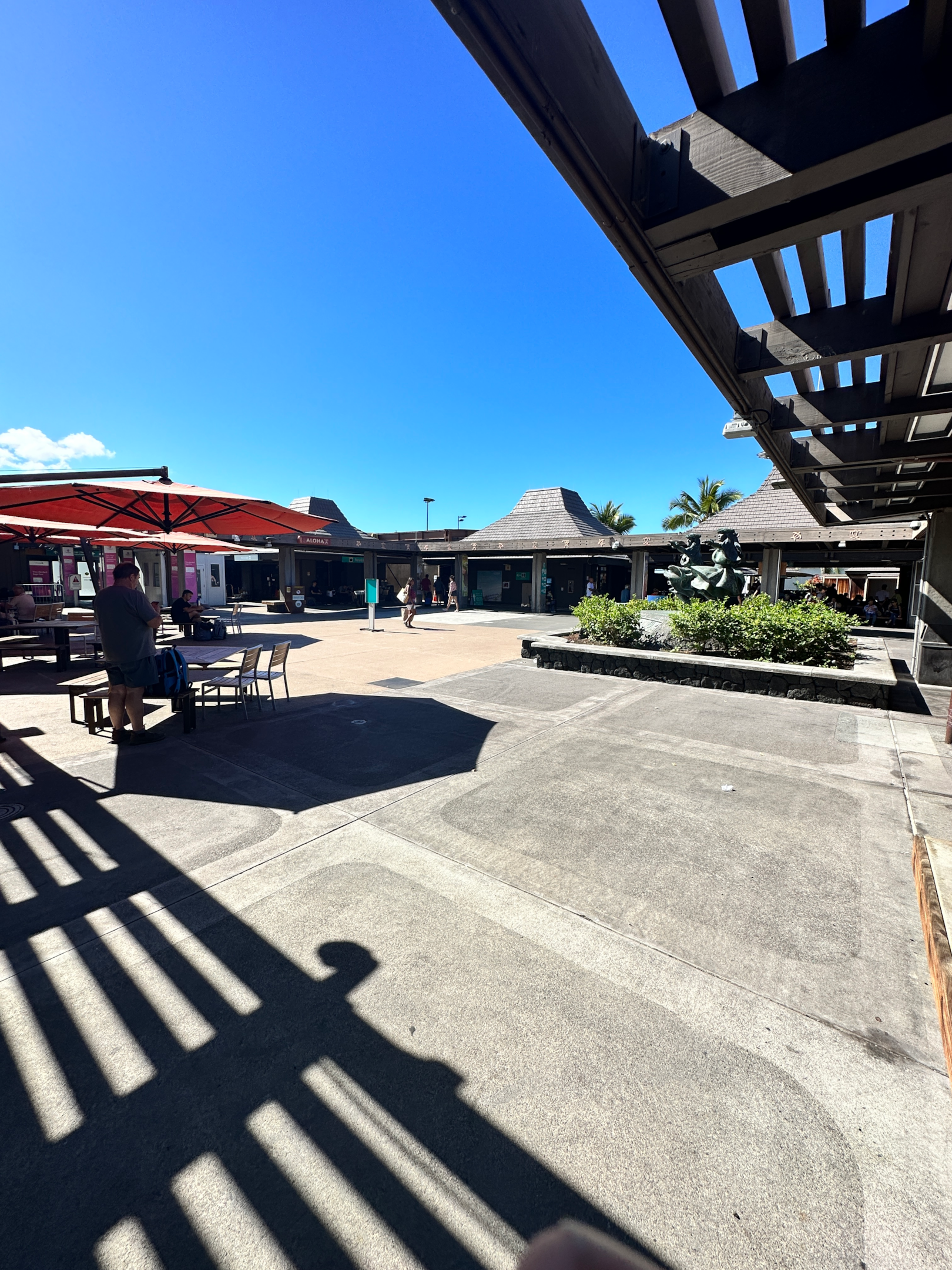 People walking in the airfield at Kona Airport