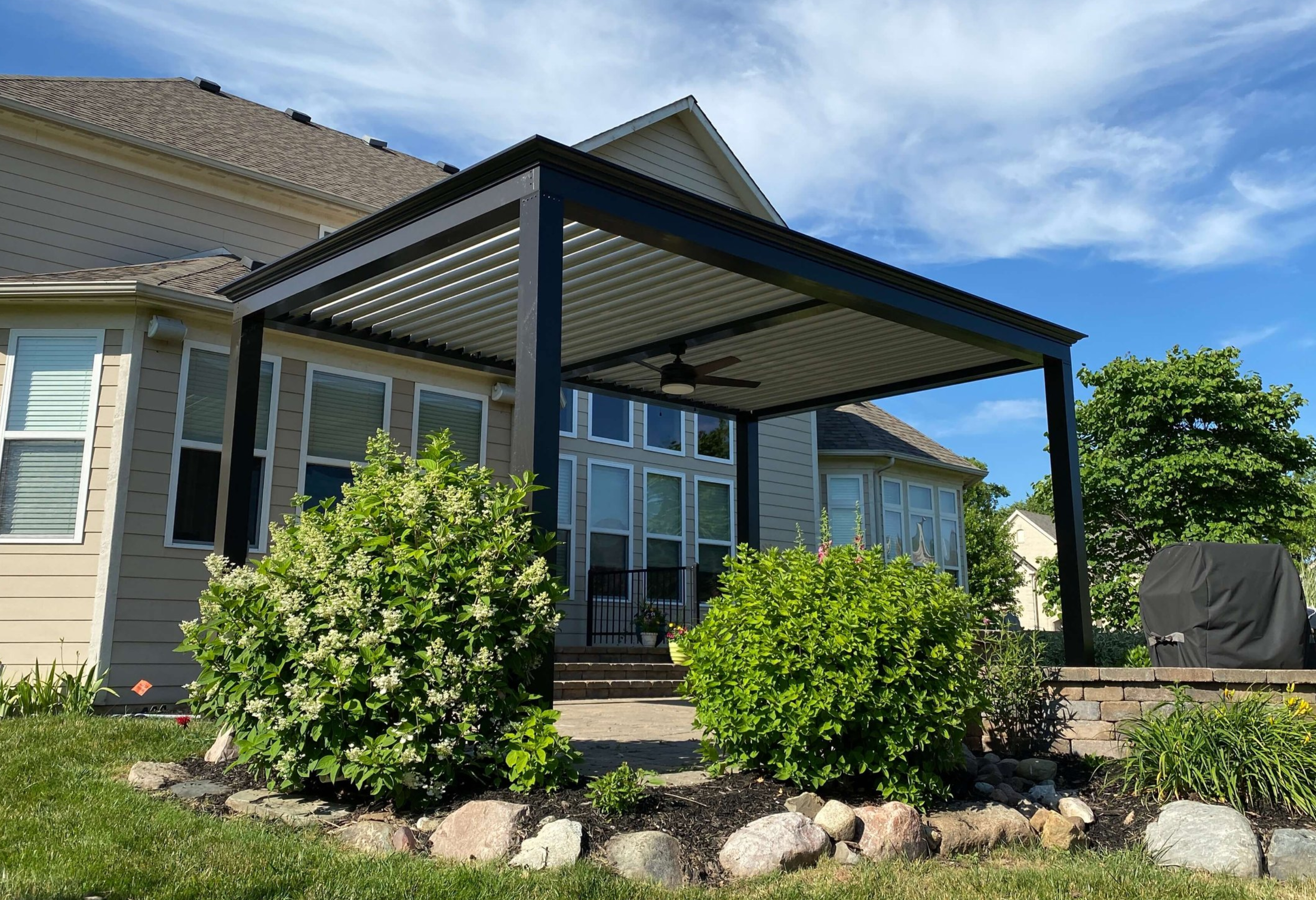 Freestanding pergola installed over a patio. The centerpiece of the outdoor living space.