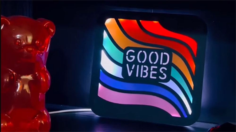 custom cut acrylic LED sign that says Good Vibes