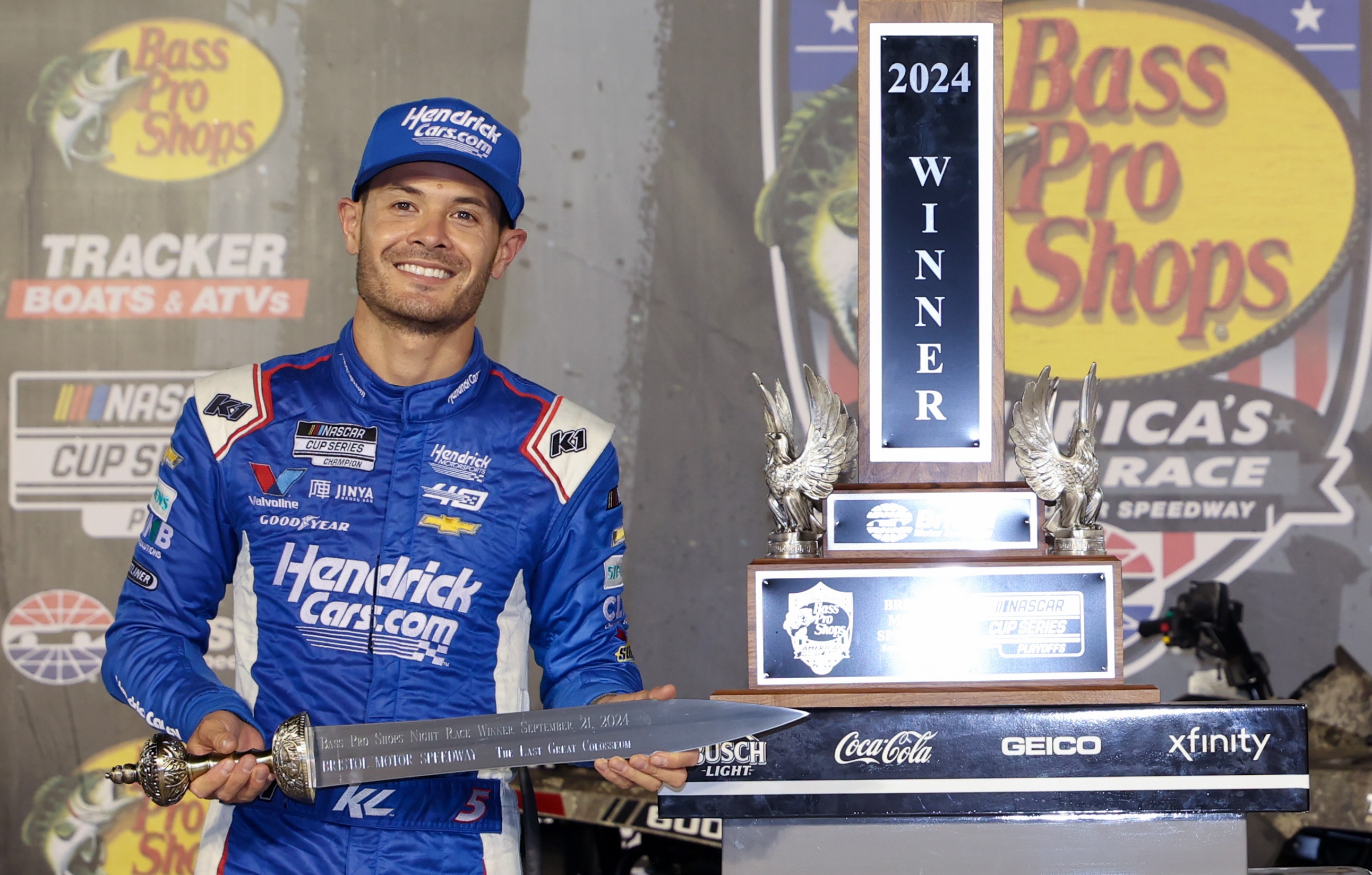 Kyle Larson, driver of the #5 HendrickCars.com Chevrolet, celebrates with the gladiator sword in victory lane after winning the NASCAR Cup Series Bass Pro Shops Night Race at Bristol Motor Speedway on September 21, 2024 in Bristol, Tennessee. 