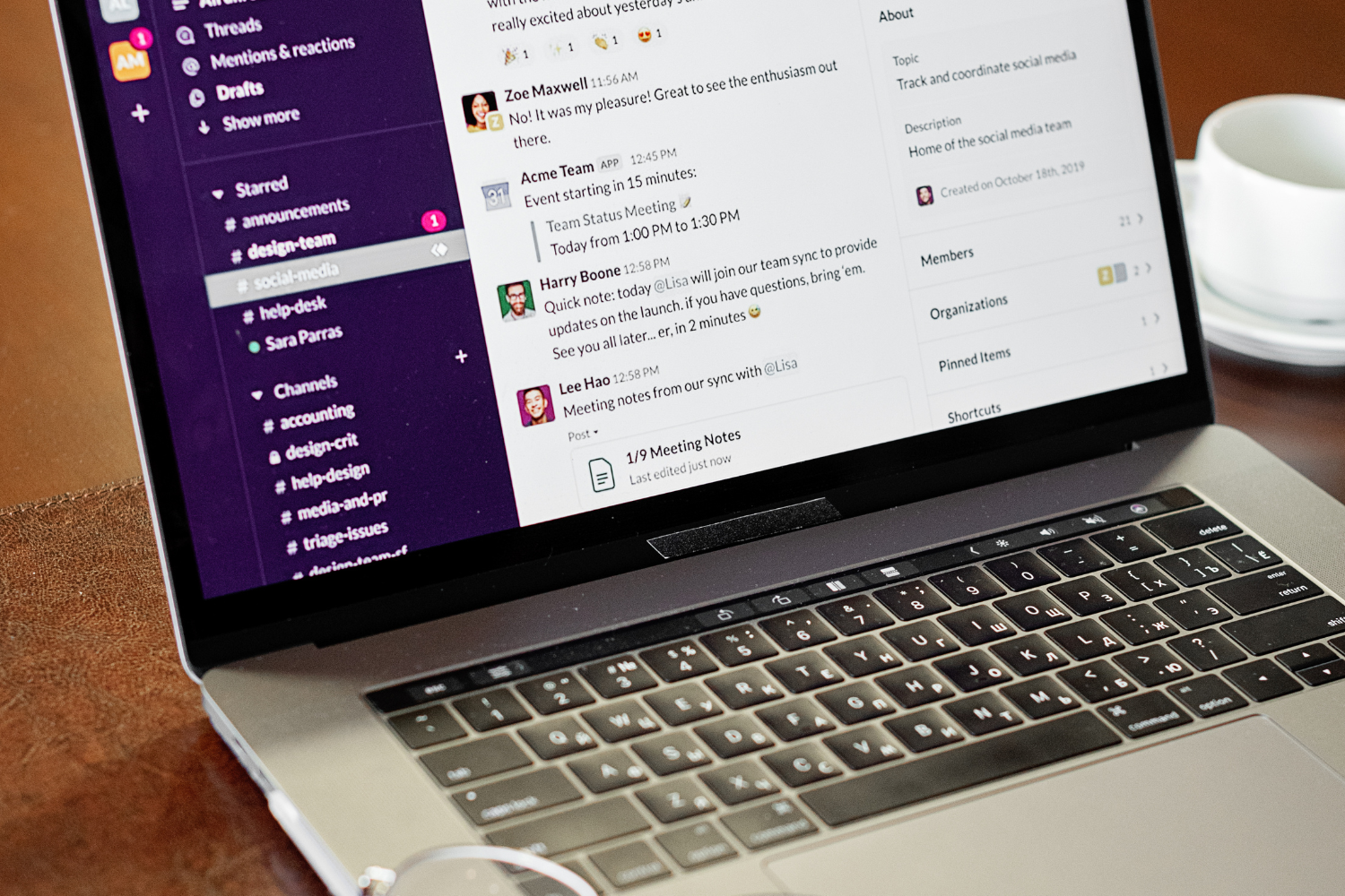 Slack messages showing on laptop screen.