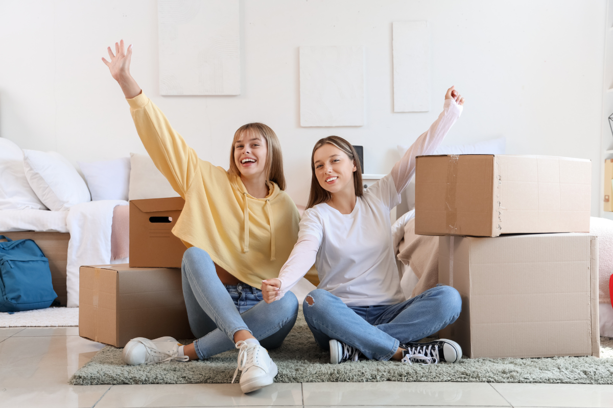 An illustration depicting a busy move-in day for college students with boxes and dorm essentials.