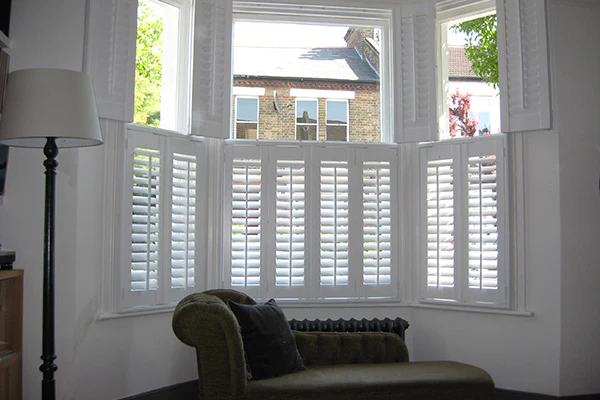 bay window with white plantation shutters