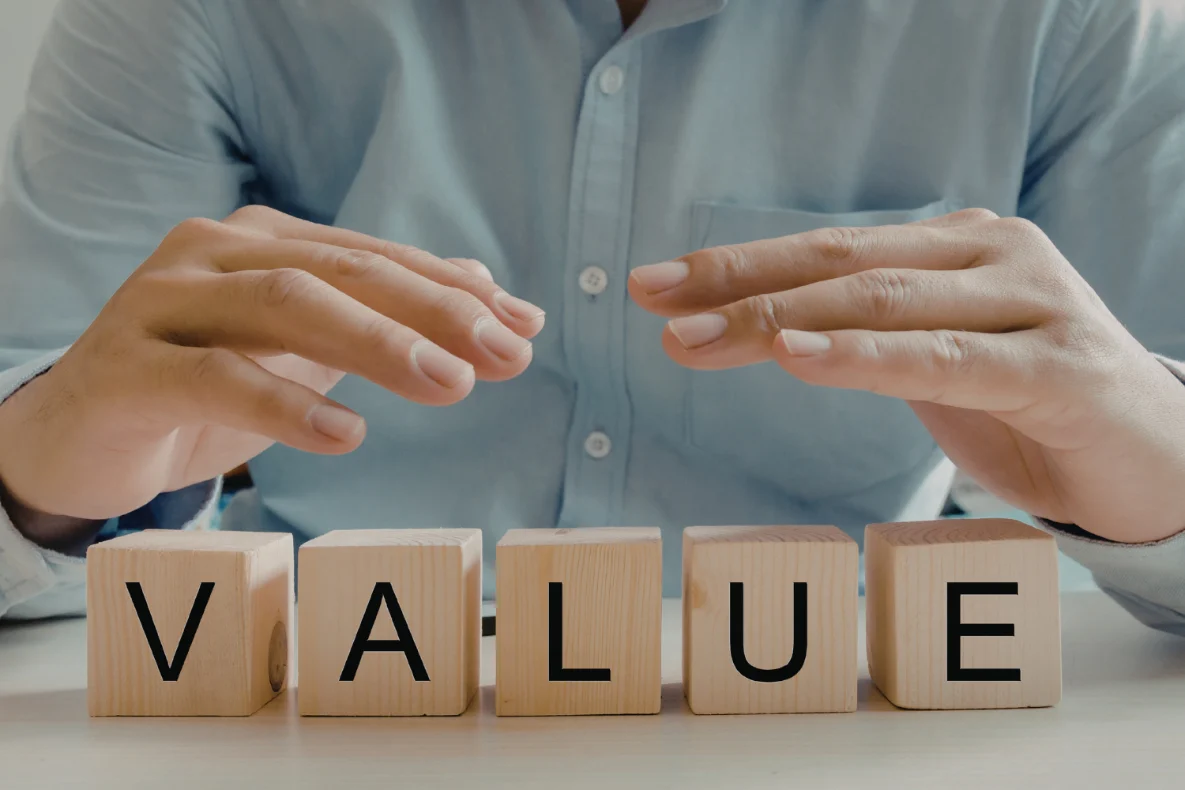 Wooden blocks showing the word "value", which is important for a person asking, "How much is my company worth?"