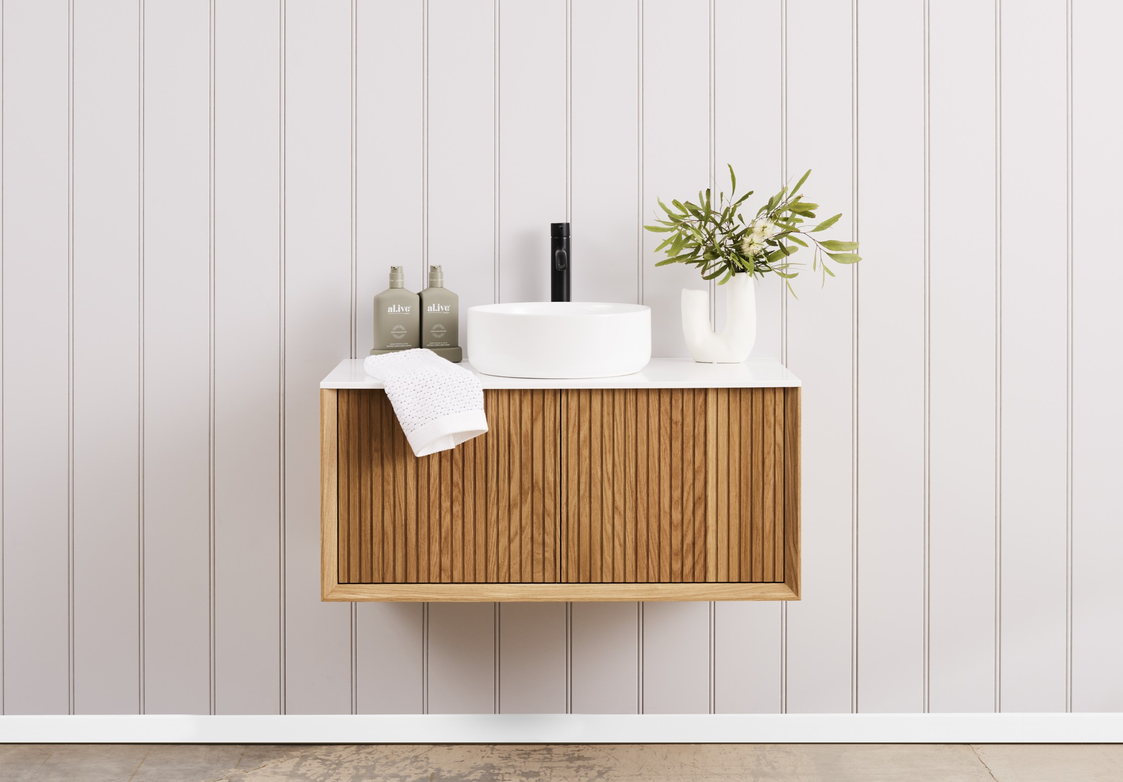 A wall hung vanity unit in a small bathroom, creating more space