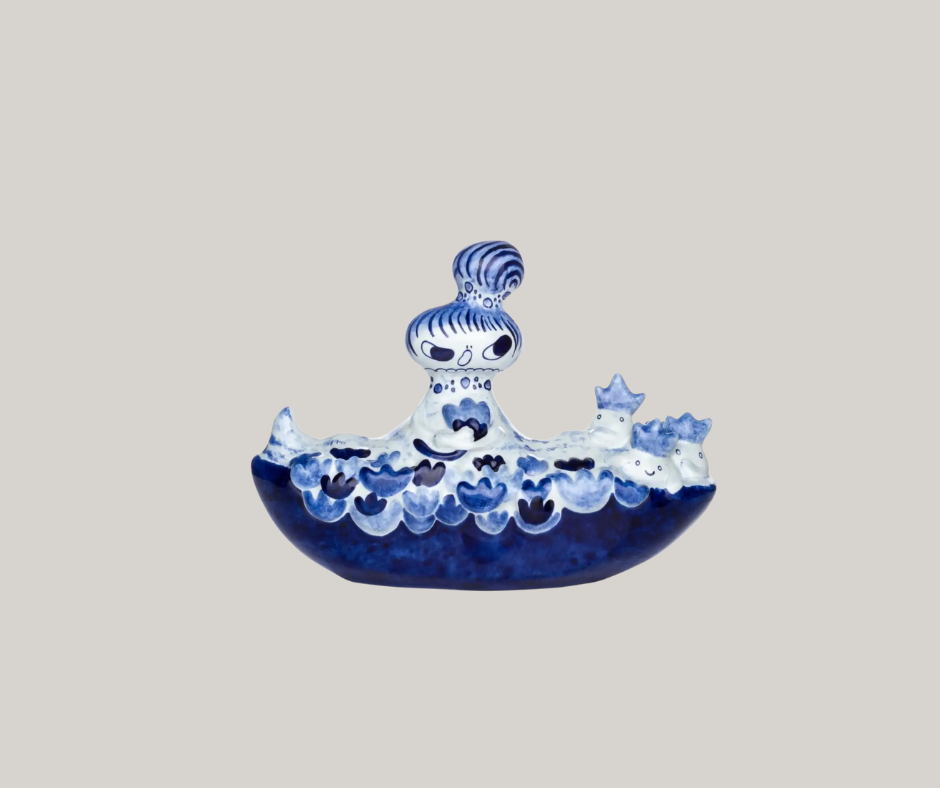 a playful blue and white color scheme sculpture that has water themes but is unique