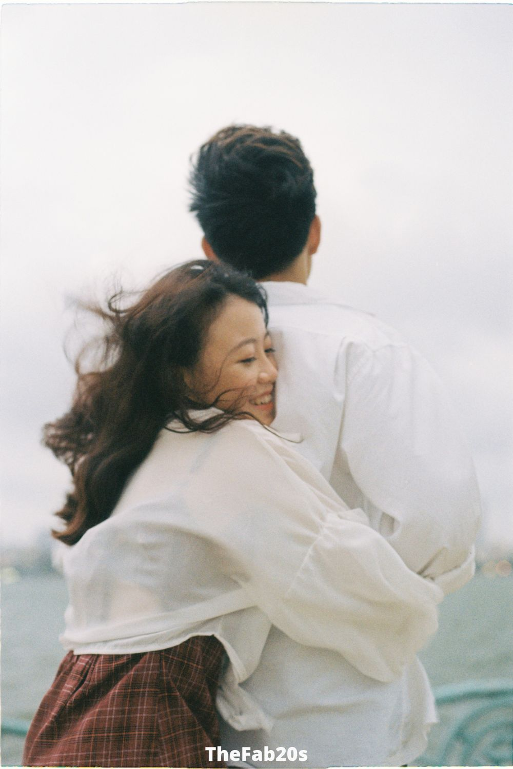 Woman hugging a man from behind -  Featured In How To Know When A Leo Man Is Playing You