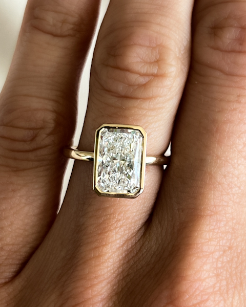 Bezel Set Engagement ring with an Elongated Radiant cut diamond