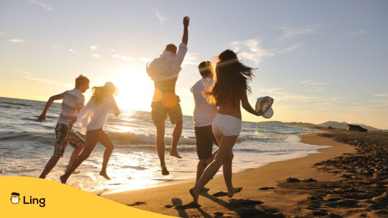 People Group Running on the Beach