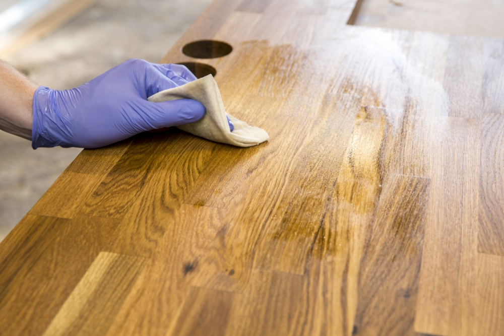 Re-oil and re-wax old wooden furniture to bring back the shine