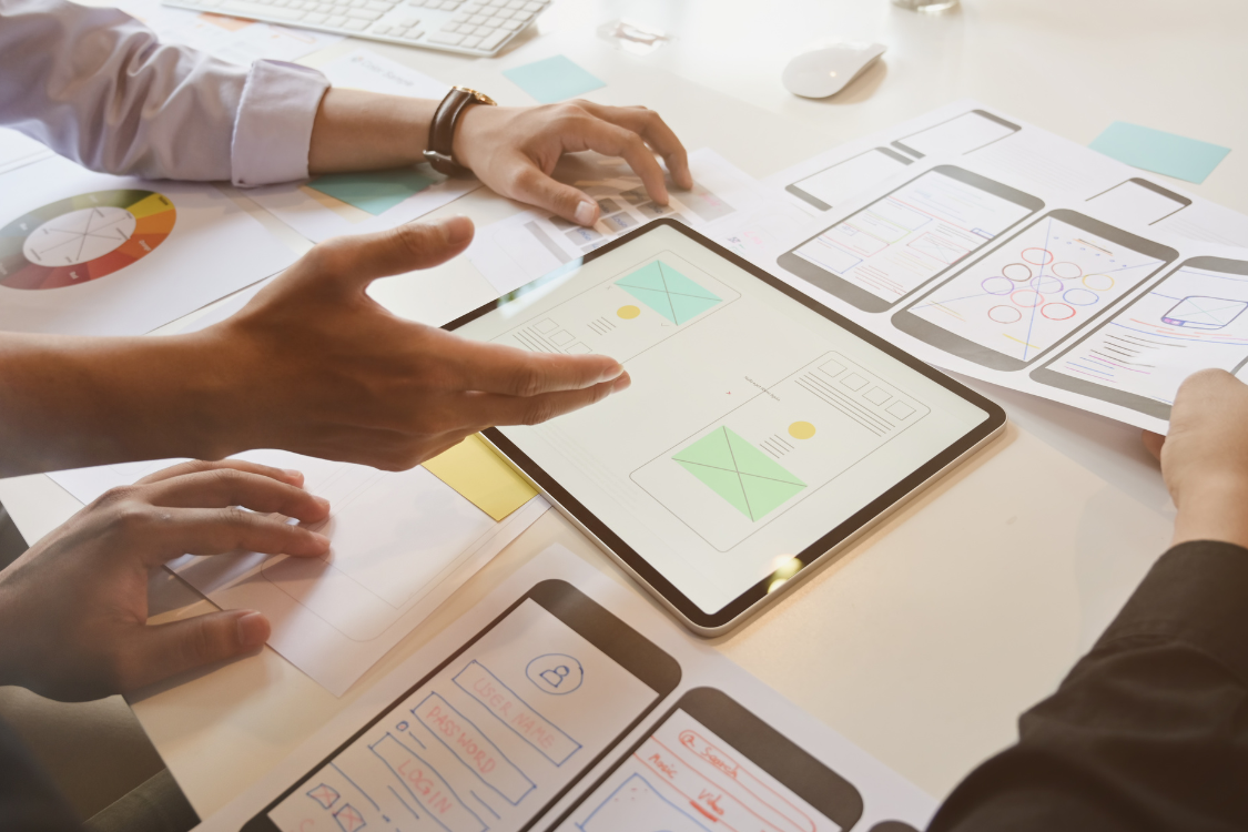 Team reviewing product design plans to support supplement manufacturer brand alignment
