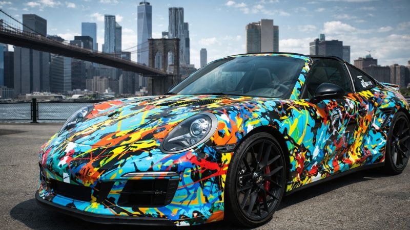 A car wrapped in vinyl wrap having abstract paint-splatter