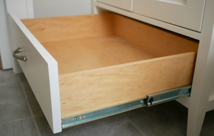 open drawer with bottom slides on the outer walls