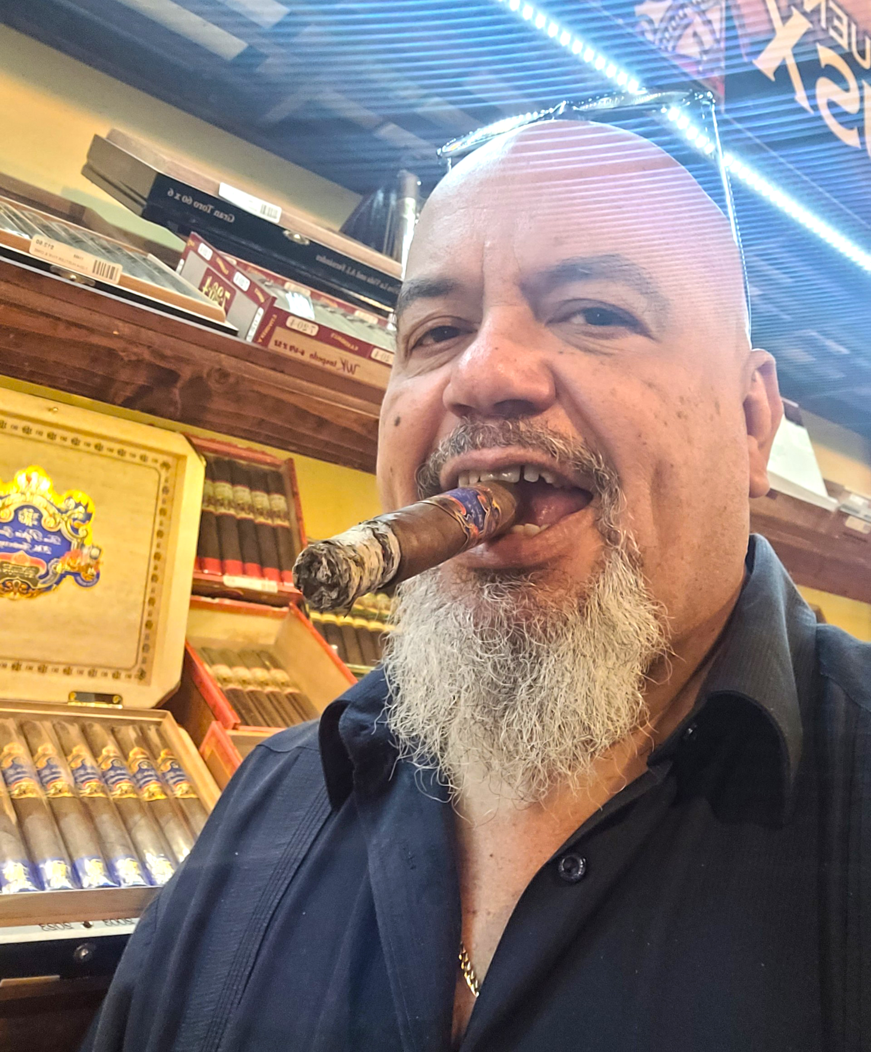 A photo of a satisfied customer holding the Don Pepín García 20th Anniversary Limited Edition cigar with a big smile on his face.