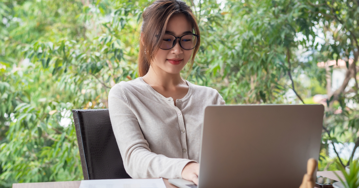A woman organizing finances using bookkeeper accounting software