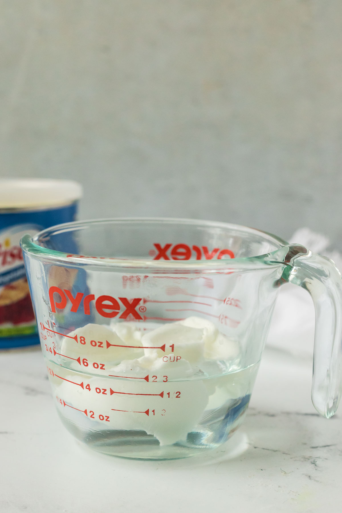 shortening in a liquid measuring cup of water