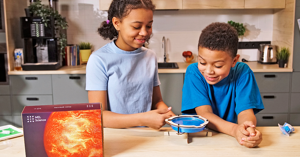 Two kids doing an experiment with Mel Chemistry