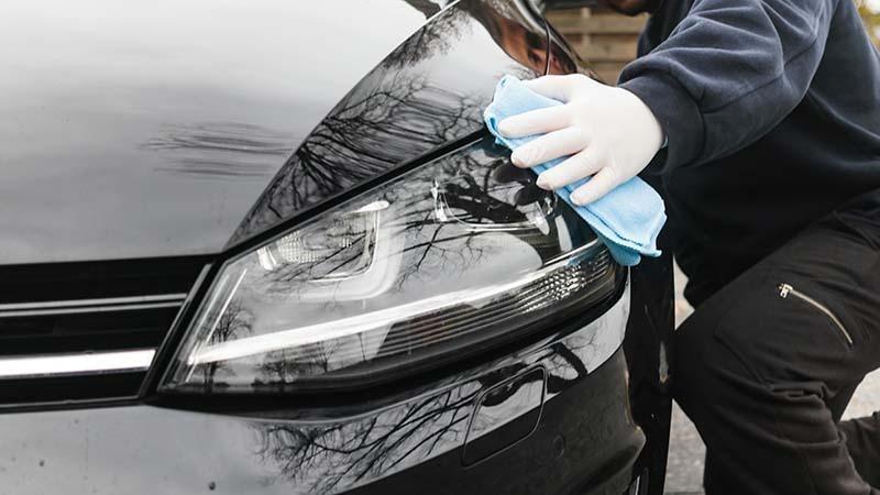 Microfiber towel on car headlights