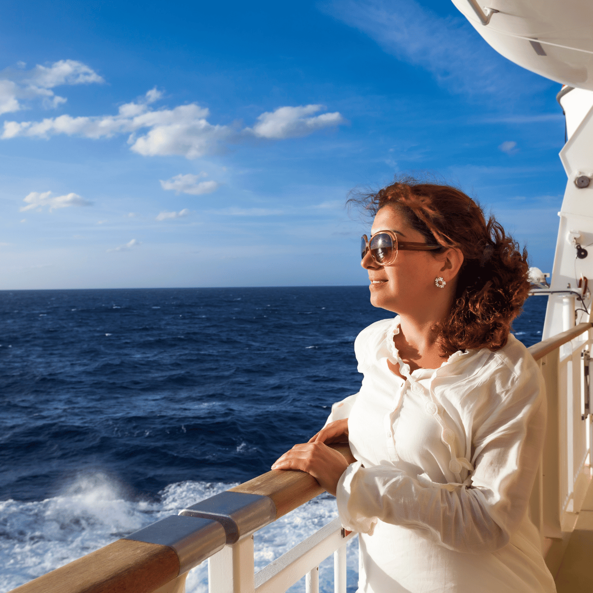 woman looking out at sea on a cruise ship
