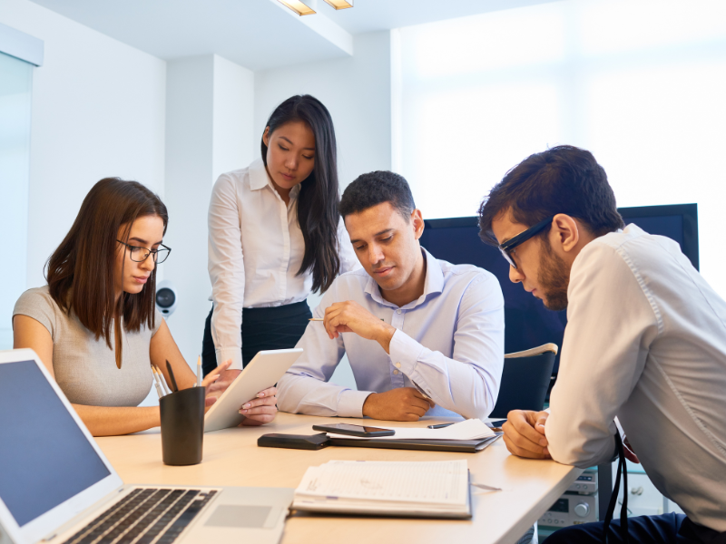 Image showing a person talking with insurance company representatives.