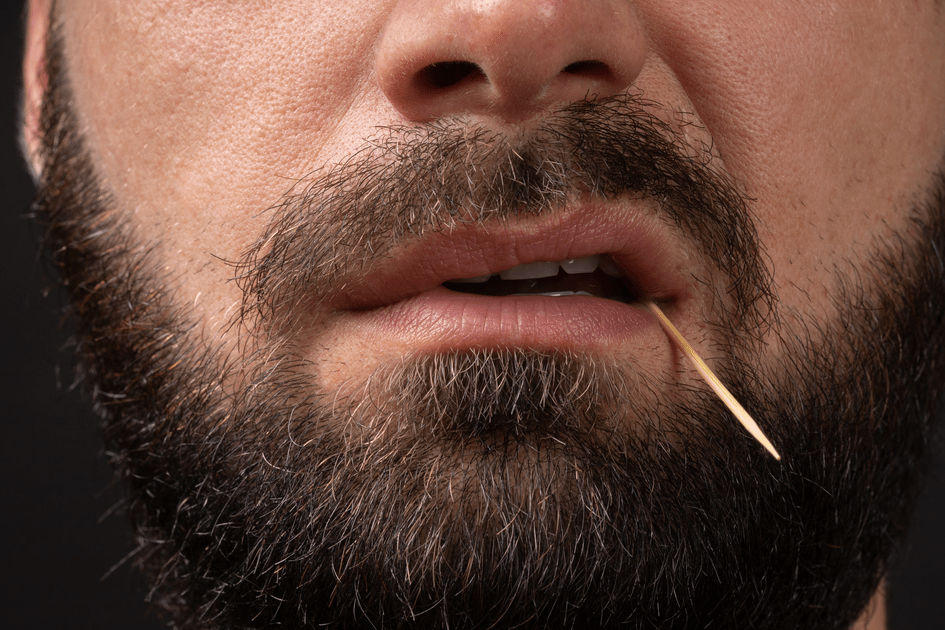 Man with toothpick in mouth in New York, actively working on marriage to alleviate ADHD symptoms and enhance relationship quality.