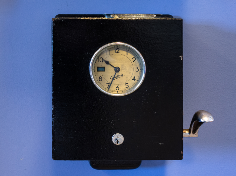 alt="Old style punch time clock"