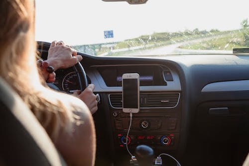Woman setting out on a road trip to the perfect place for her