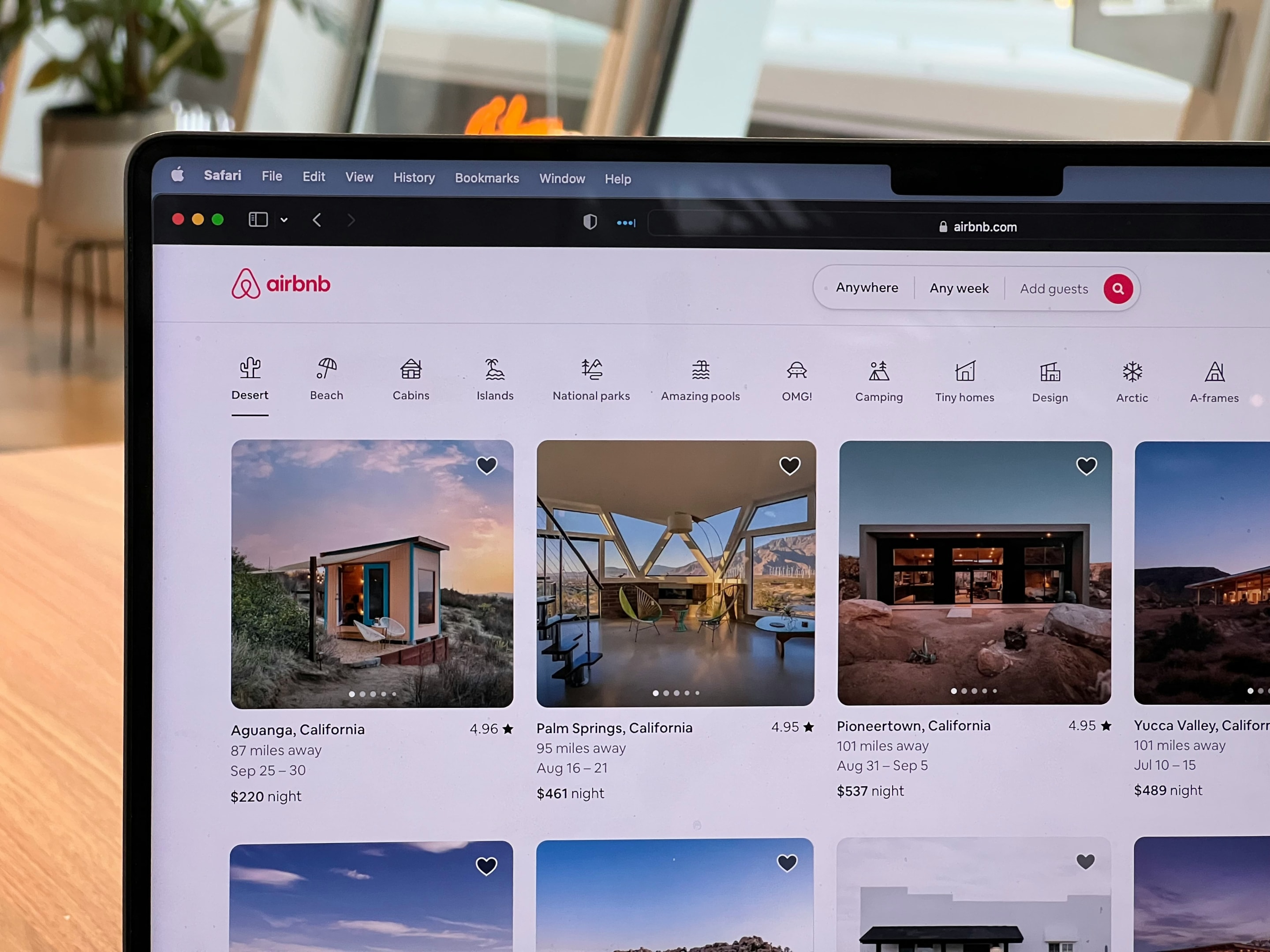 Airbnb listings on laptop.