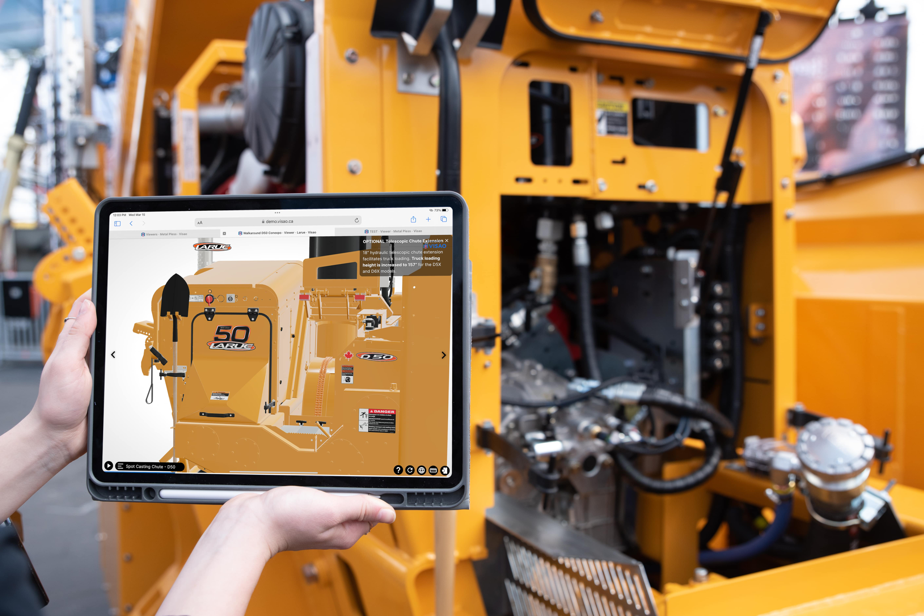 woman hand holding ipad next to machinery