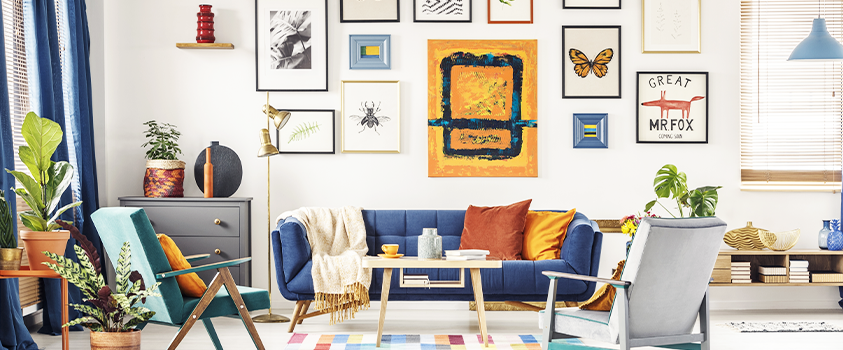A colourful, eye-catching gallery wall can fill a blank wall and tie together your living space.