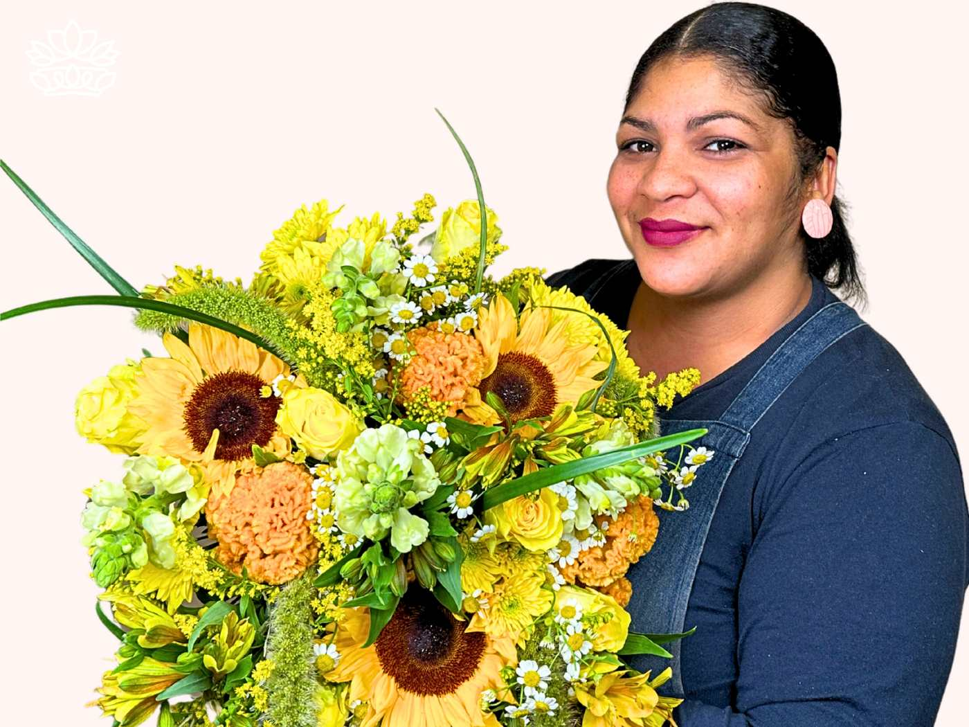 Professional florist presenting a sunlit bouquet from the Florist Choice Bouquets Collection, brimming with sunflowers, yellow roses, and verdant accents. Ideal for corporate gifts, occasions, or as part of gift hampers. Delivers an impeccable example of expert flower arrangements. Fabulous Flowers and Gifts.