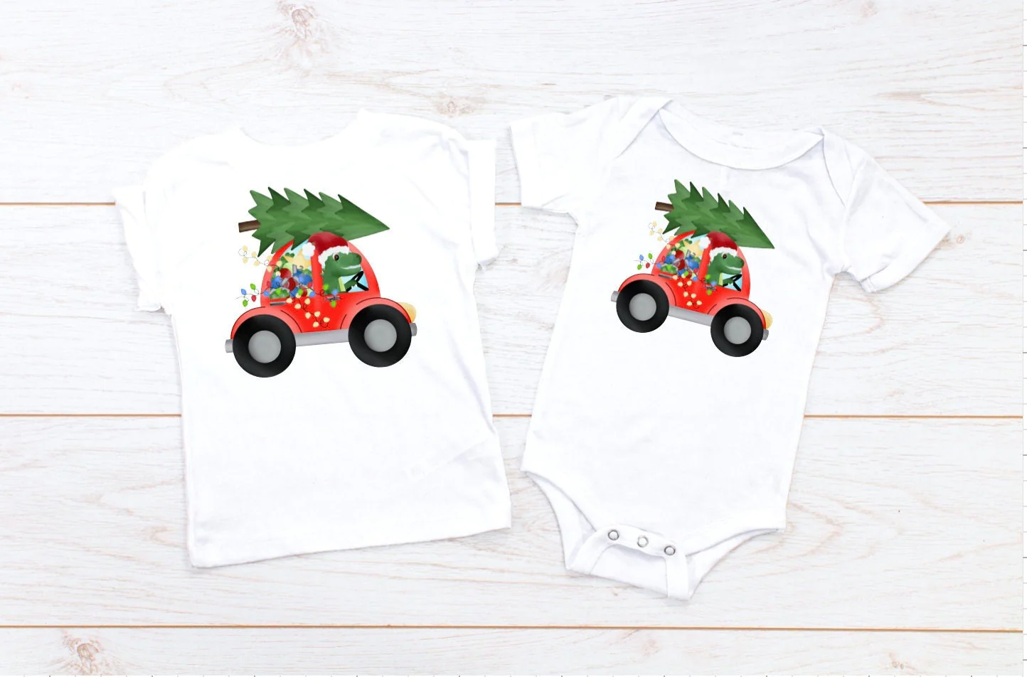 Short-sleeved matching Christmas outfits for kids featuring dino graphics.